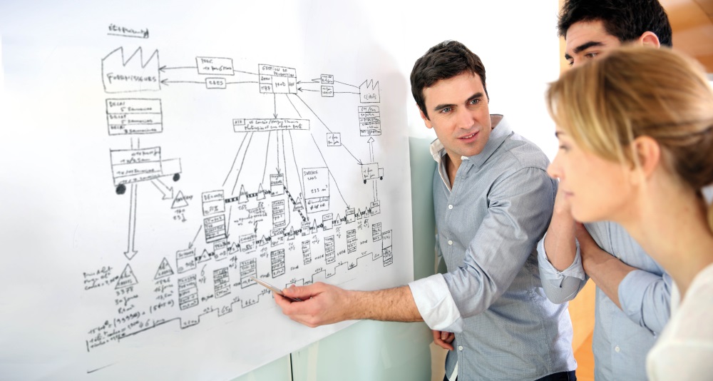 Architects in office looking at construction project