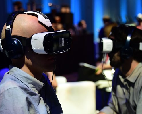 People test out the Oculus-made Samsung Gear VR Virtually Reality headset on display at the Oculus Connect 2 event in Hollywood, California on September 24, 2015. AFP PHOTO/ FREDERIC J. BROWN / AFP / FREDERIC J. BROWN